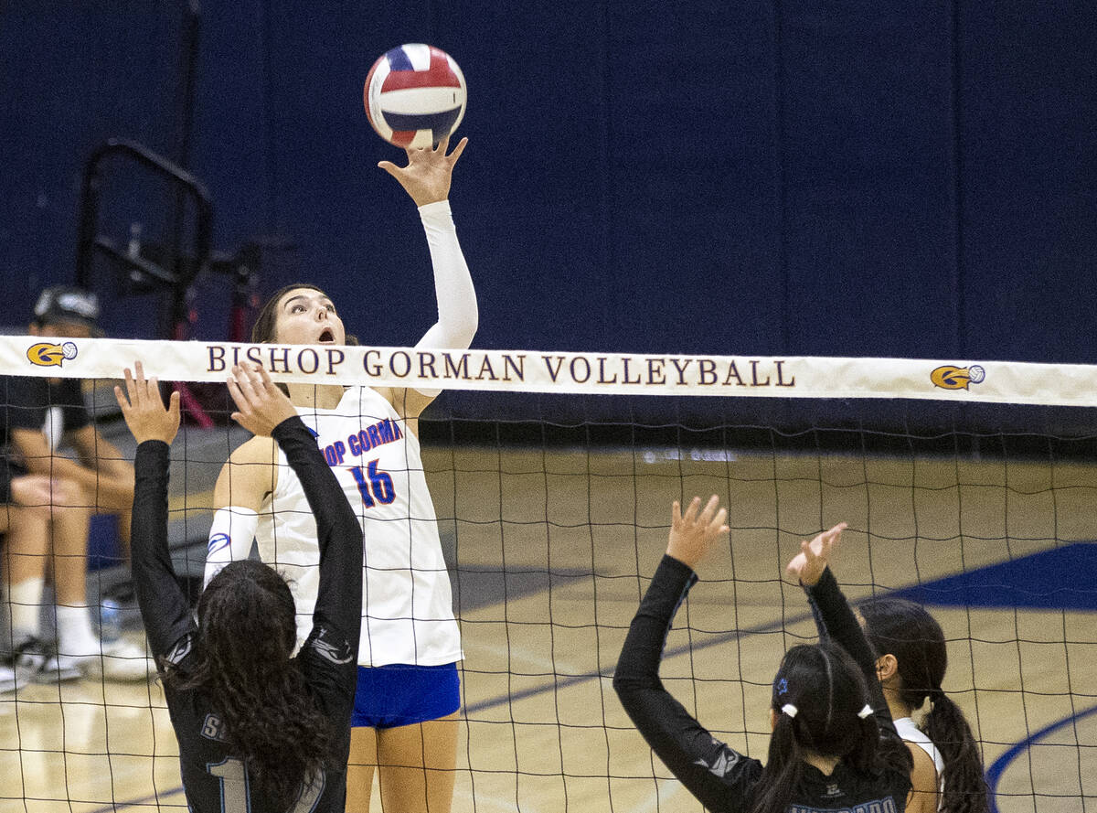 Bishop Gorman junior Charlie Wilson (16) lightly taps the ball over the net during the high sch ...