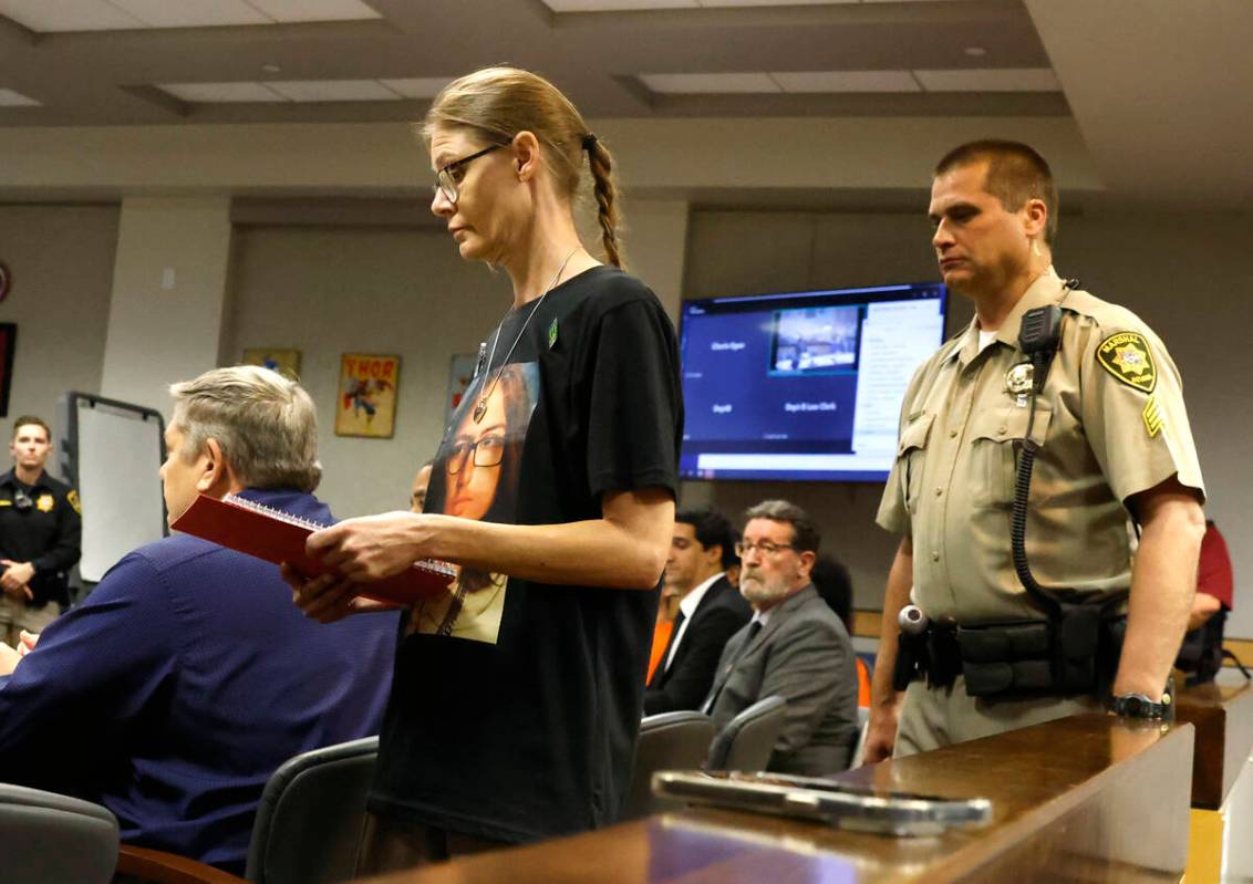 Mellisa Ready, the mother of Jonathan Lewis, wearing a "Justice for Jonathan" T-shirt, prepares ...