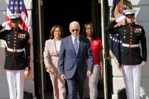 President Joe Biden arrives with Vice President Kamala Harris and Lovette Jacobs, a fifth-year ...