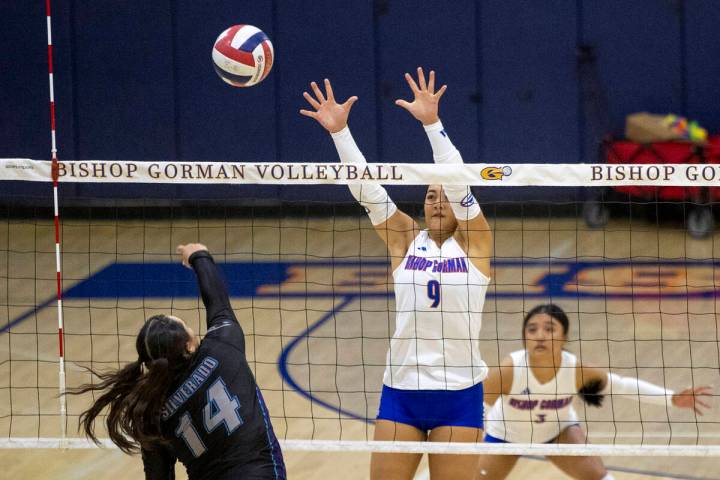 Bishop Gorman junior Trinity Thompson (9) attempts to block Silverado senior Isabella Hemingway ...