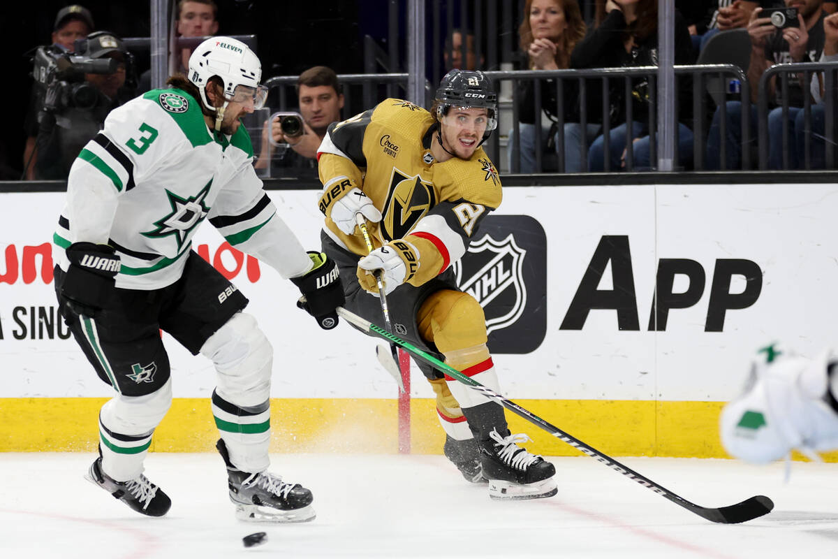 Golden Knights center Brett Howden (21) whips a pass up the ice while Stars defenseman Chris Ta ...