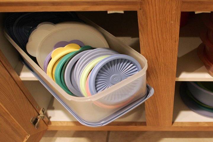 Tupperware lids are seen inside of containers at a home in Henderson, Nev. March 31, 2005. (Las ...