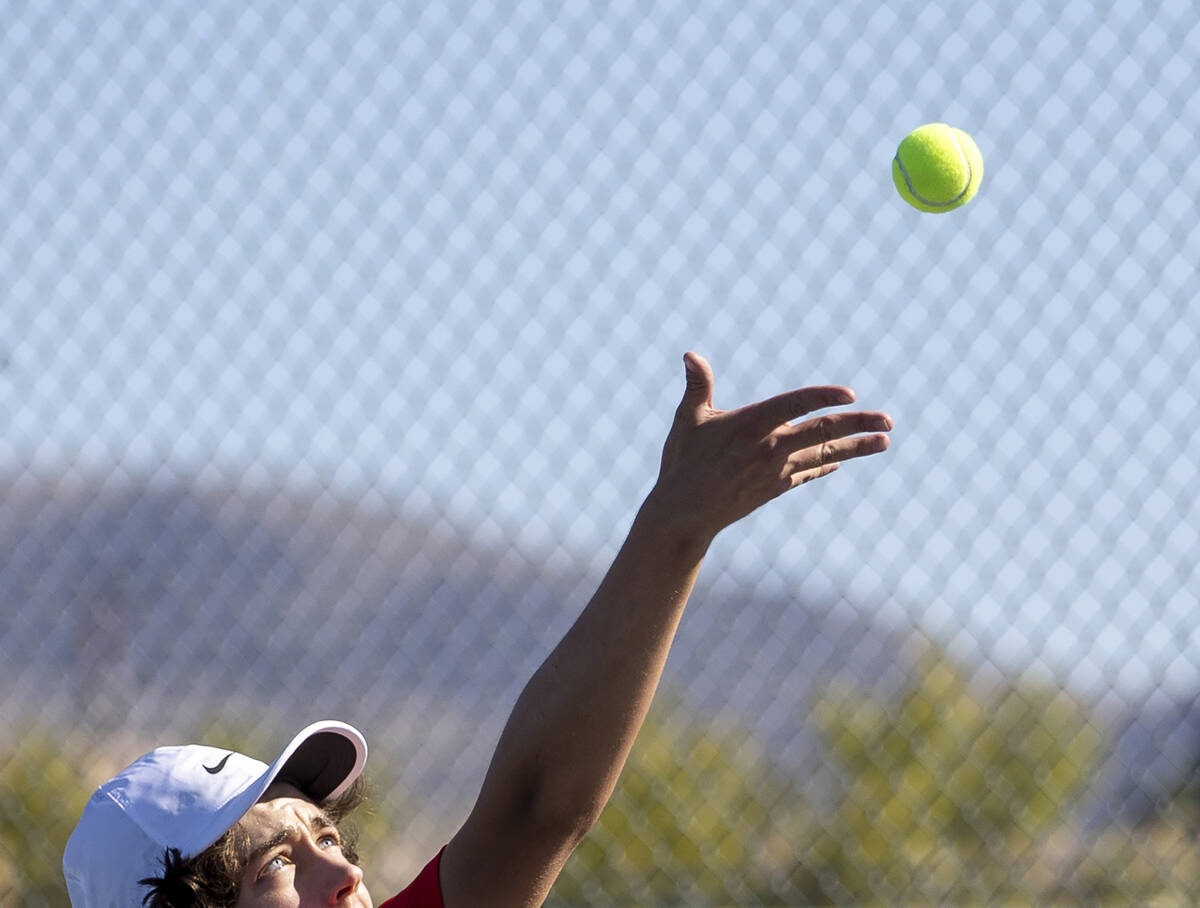 Coronado’s Jacob Gardner serves the ball during the high school tennis matches against B ...