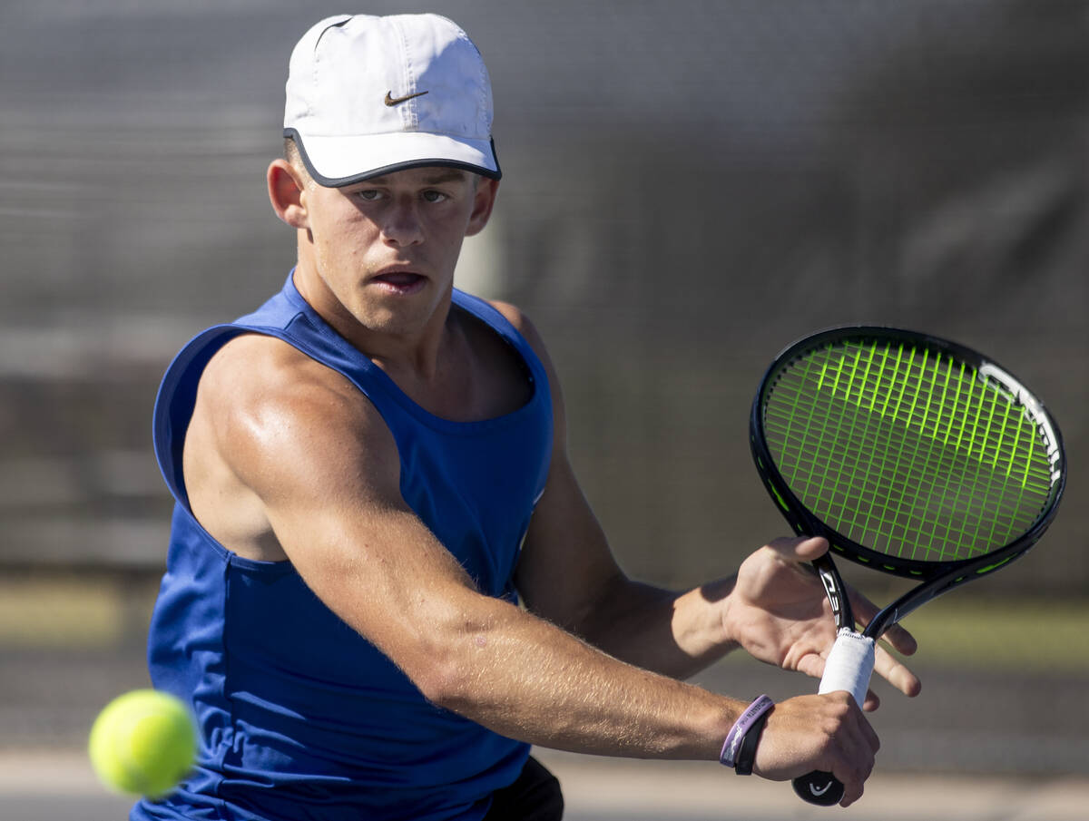 Basic’s Ryan Robinson competes during the high school tennis matches against Coronado at ...