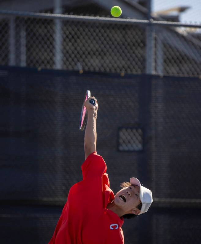 Coronado’s Grant Lee serves the ball during the high school tennis matches against Basic ...