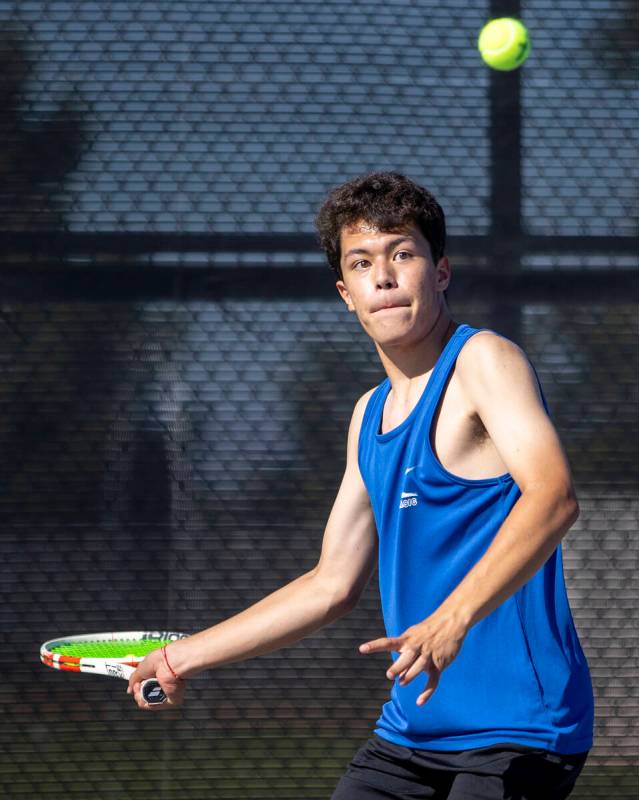 Basic’s James Stevens competes during the high school tennis matches against Coronado at ...