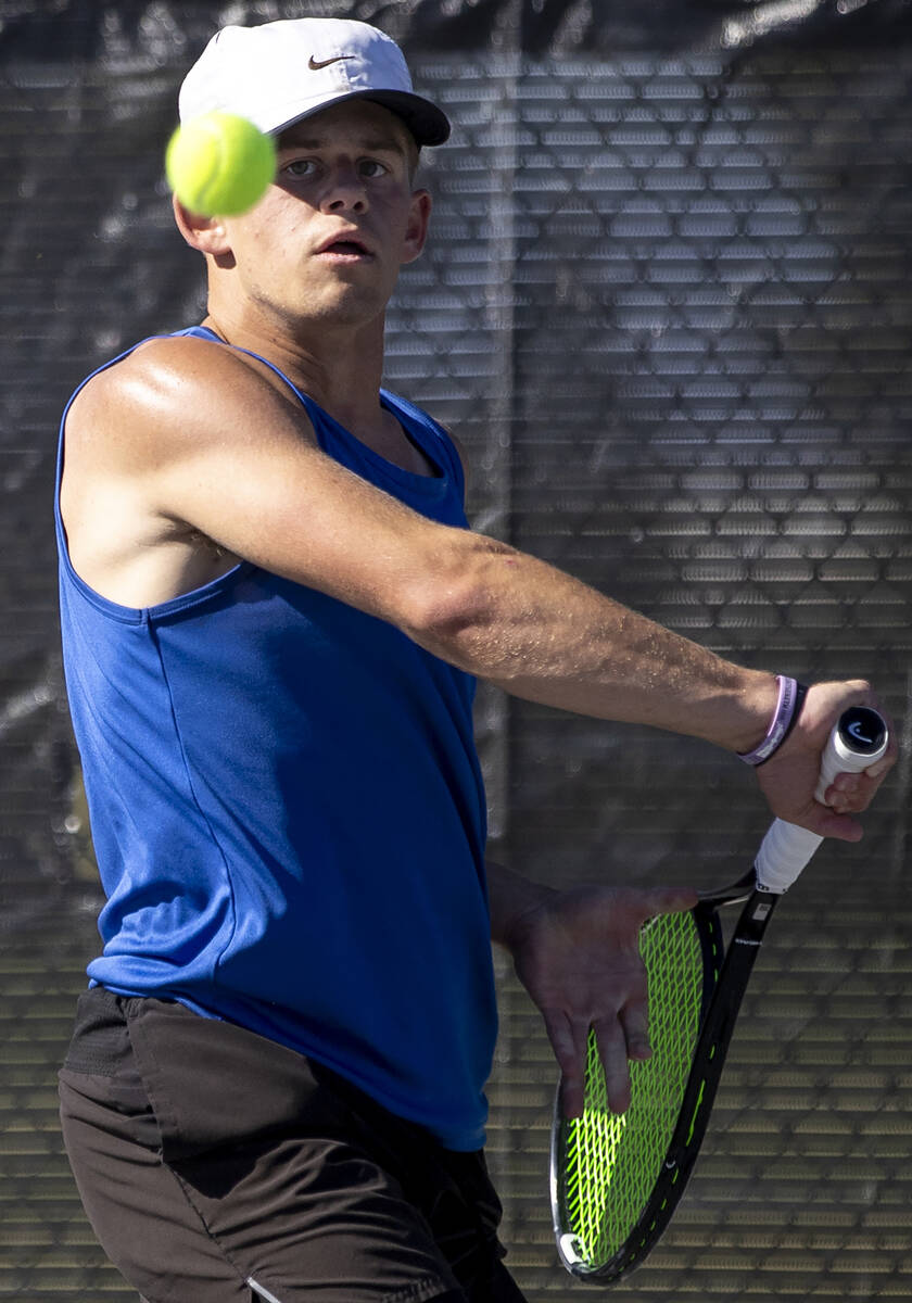 Basic’s Ryan Robinson competes during the high school tennis matches against Coronado at ...