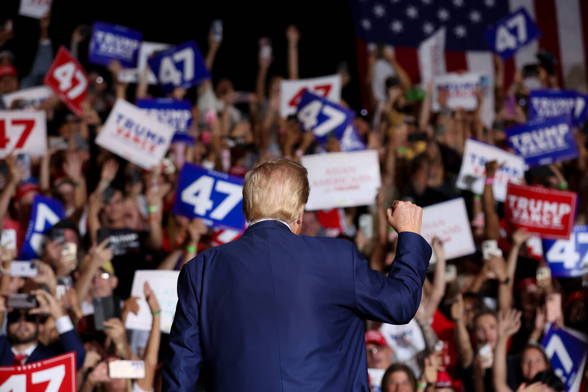 Former US President and Republican presidential candidate Donald Trump takes the stage before s ...