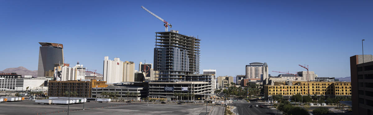 Luxury apartment high-rise Capella is seen under construction alongside Bria, left, at Symphony ...