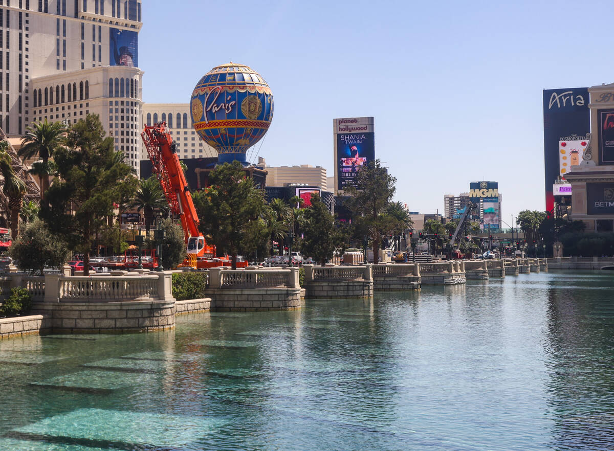 Tractors and equipment near the trees outside the Bellagio hotel-casino in Las Vegas, Tuesday, ...