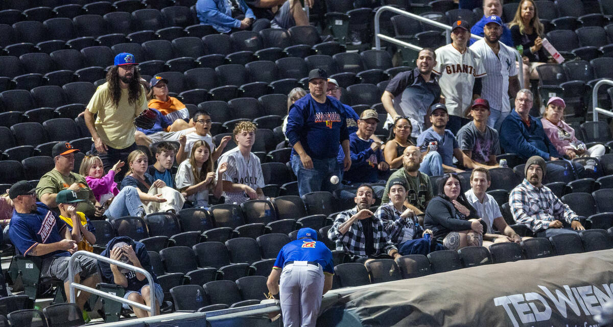 Fans react as a foul ball ends up in the stands as the El Paso Chihuahuas infielder Matthew Bat ...