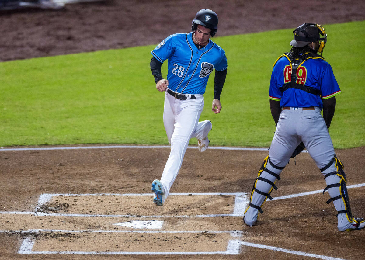 Aviators infielder Armando Alvarez (28) scores past El Paso Chihuahuas catcher Luis Campusano ( ...