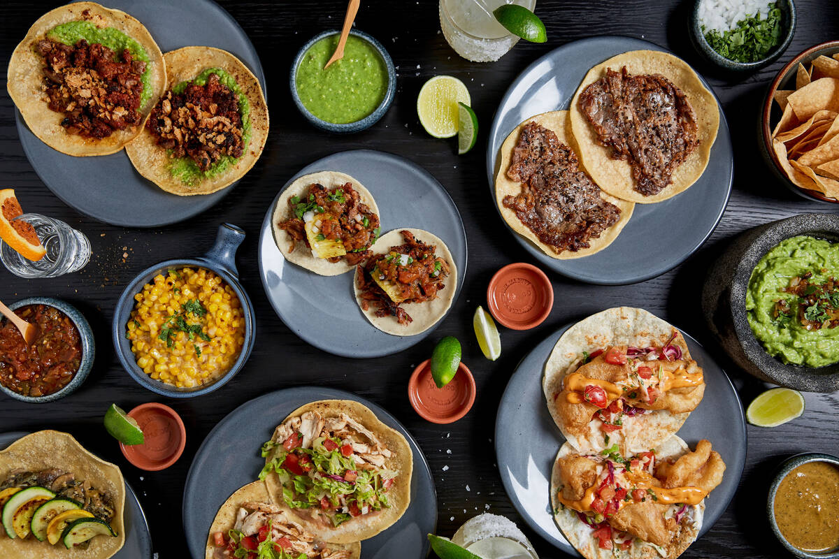 A spread of dishes from La Popular CDMX, which opened its third U.S. location on June 26, 2023, ...