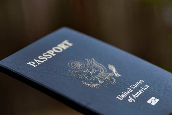 The cover of a U.S. passport is displayed in Tigard, Ore., Dec. 11, 2021. (AP Photo/Jenny Kane, ...