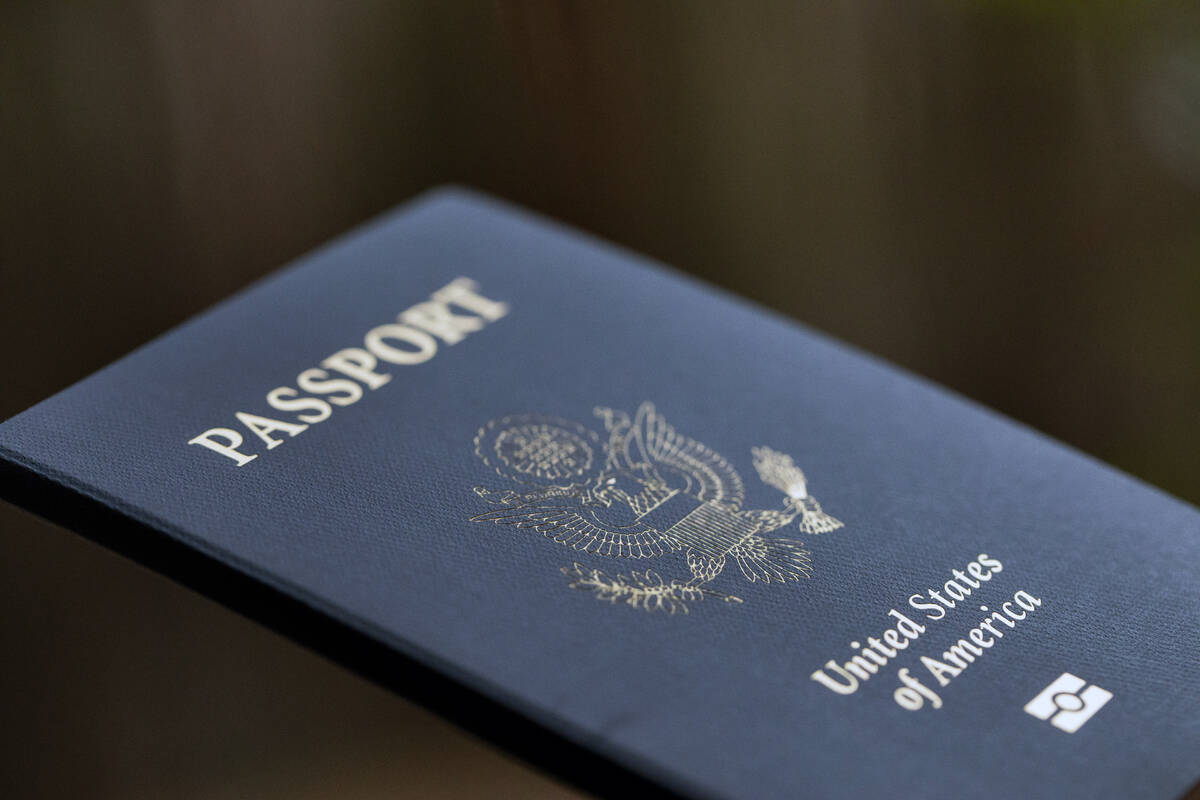 The cover of a U.S. passport is displayed in Tigard, Ore., Dec. 11, 2021. (AP Photo/Jenny Kane, ...