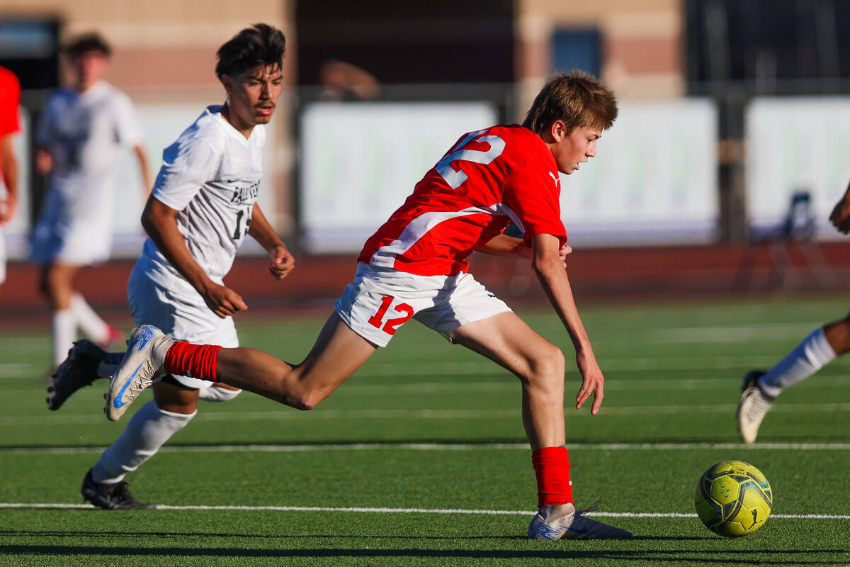 Coronado midfielder Liam Bringhurst (12) chases down the ball during a soccer game between Coro ...