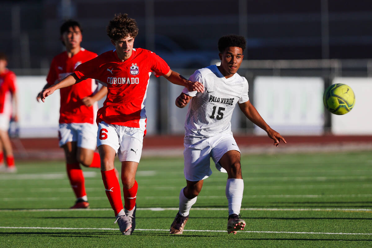 Coronado midfielder Dalton Meusy (6) and Palo Verde forward Trevon Aytch (15) race towards the ...