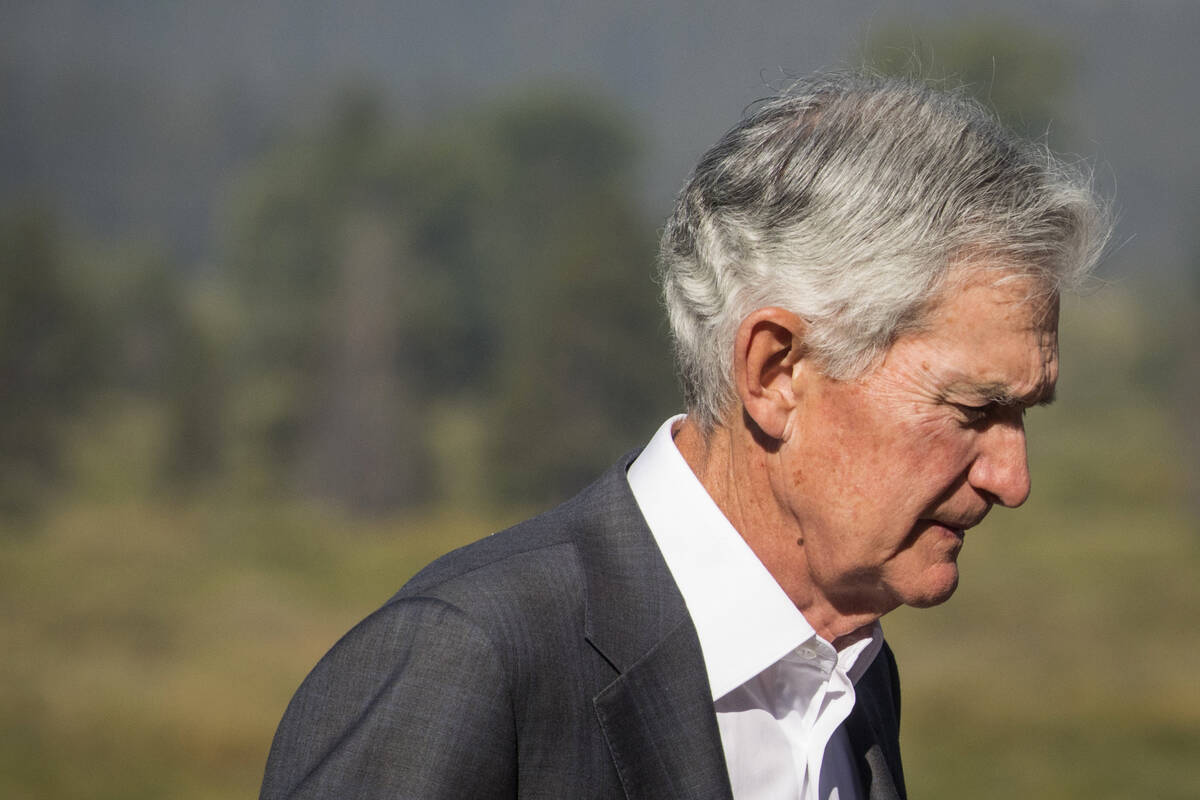 Federal Reserve Chair Jerome Powell walks outside of the Jackson Hole Economic Symposium at Jac ...