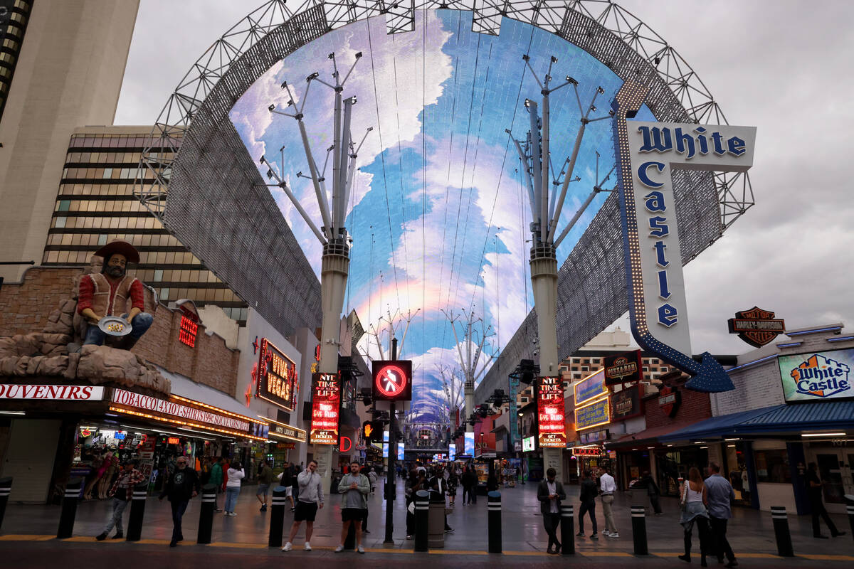 People walk through the Fremont Street Experience in downtown Las Vegas on Wednesday, Nov. 15, ...