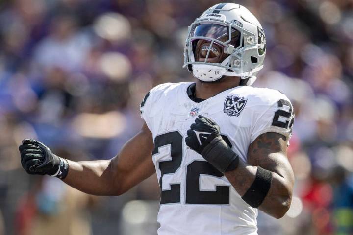 Raiders running back Alexander Mattison (22) celebrates after scoring on a touchdown run during ...