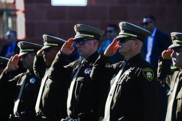 Members of the Metropolitan Police Department salute during the 1 October Sunrise Remembrance c ...