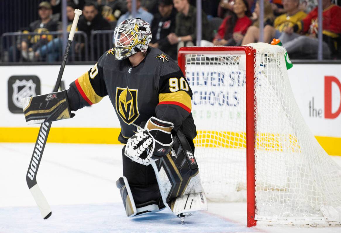 Golden Knights goaltender Robin Lehner (90) kneels by the net during a break in the second peri ...