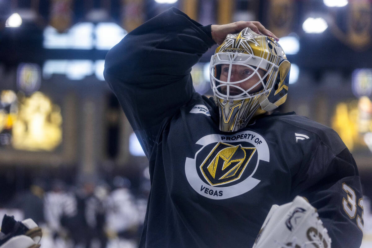 Golden Knights goaltender Adin Hill (33) adjusts his helmet during the first day of training ca ...