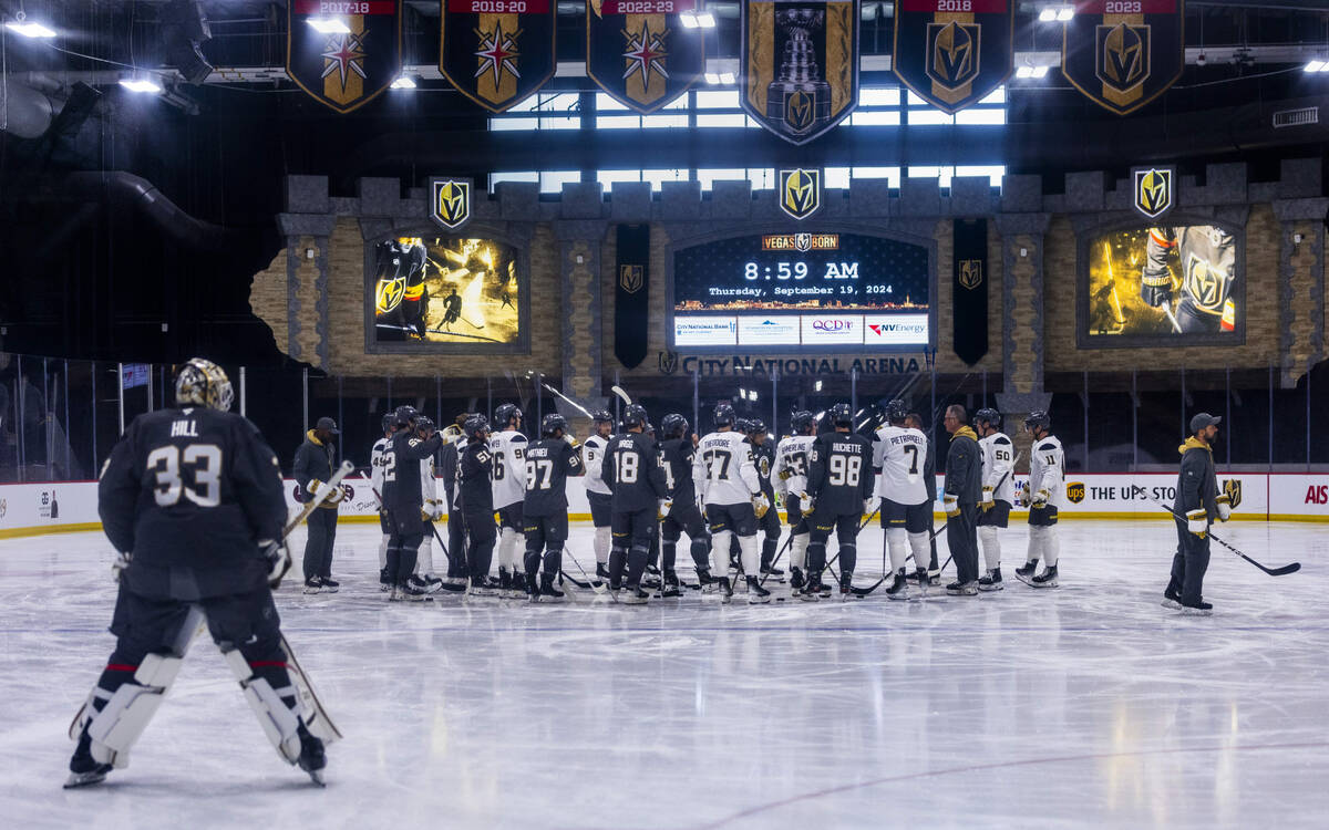 Golden Knights Head Coach Bruce Cassidy gathers his players on the ice during the first day of ...