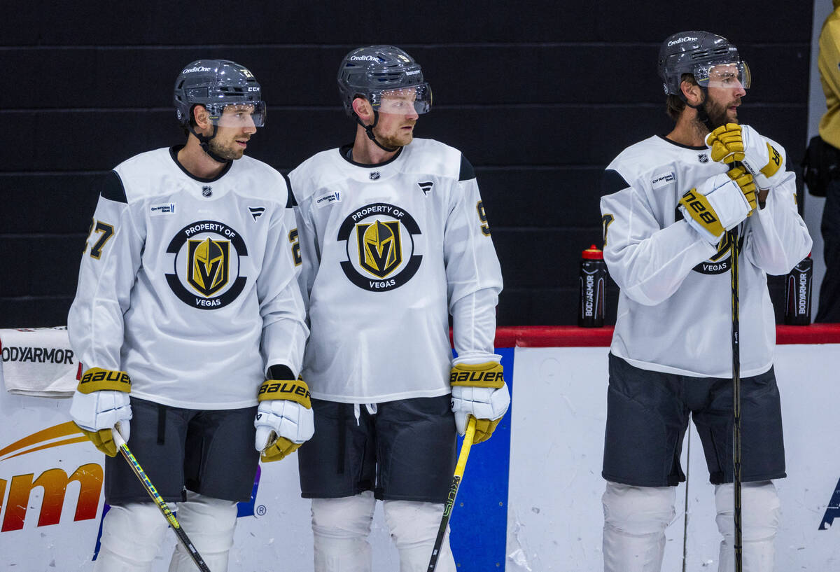 Golden Knights defenseman Shea Theodore (27), center Jack Eichel (9) and defenseman Alex Pietra ...