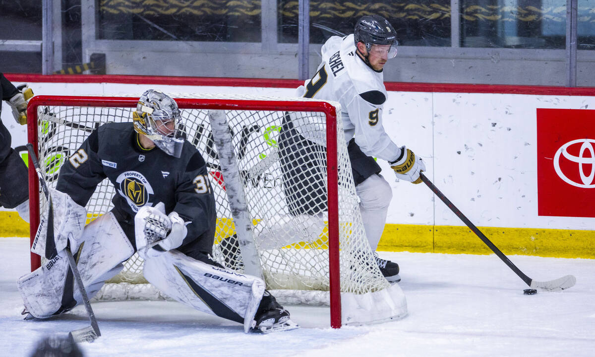 Golden Knights center Jack Eichel (9) looks to turn the corner for a shot against goaltender Je ...