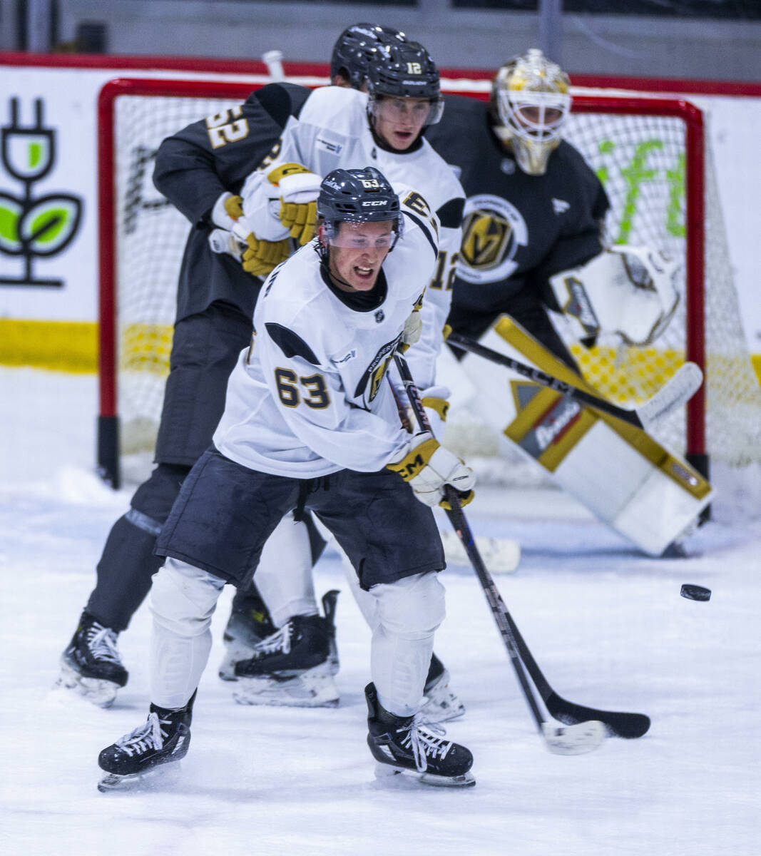 Golden Knights forward Ben Hemmerling (63) looks to stop the puck during the first day of train ...