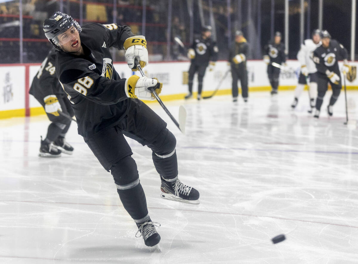 Golden Knights forward Mikael Huchette (98) takes a shot on goal during the first day of traini ...