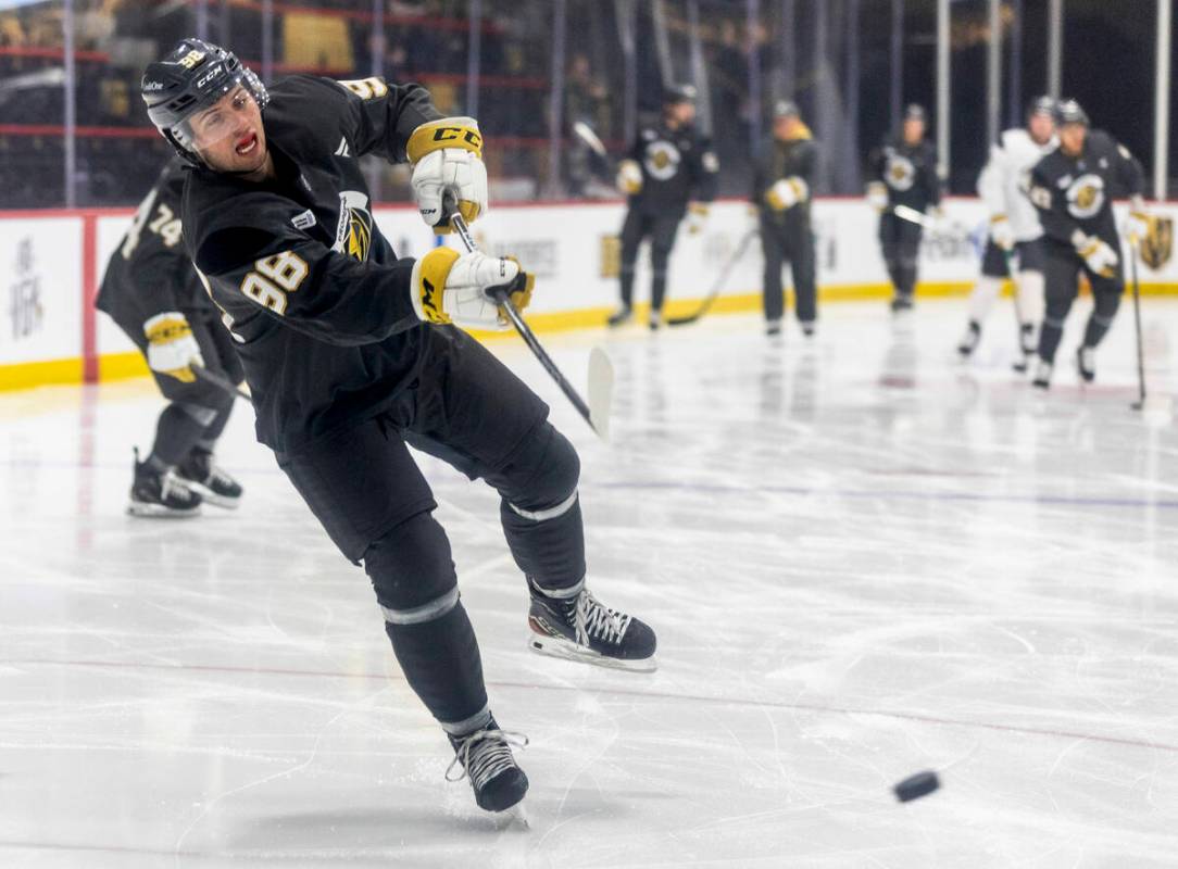 Golden Knights forward Mikael Huchette (98) takes a shot on goal during the first day of traini ...