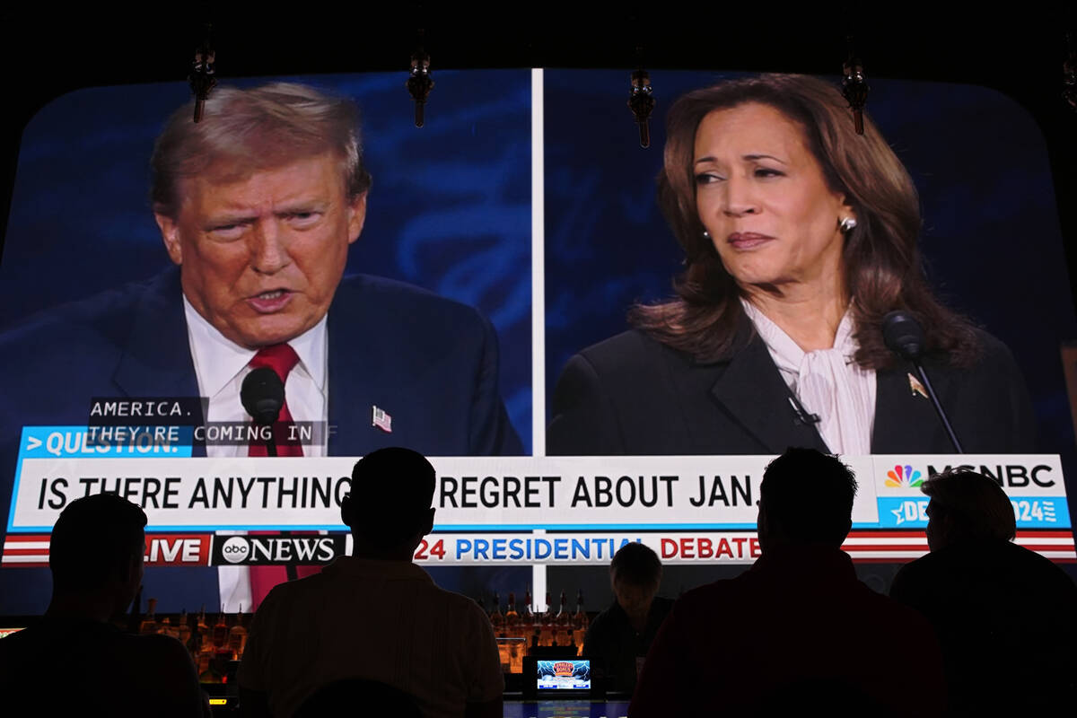 People watch the presidential debate between Republican presidential nominee former President D ...