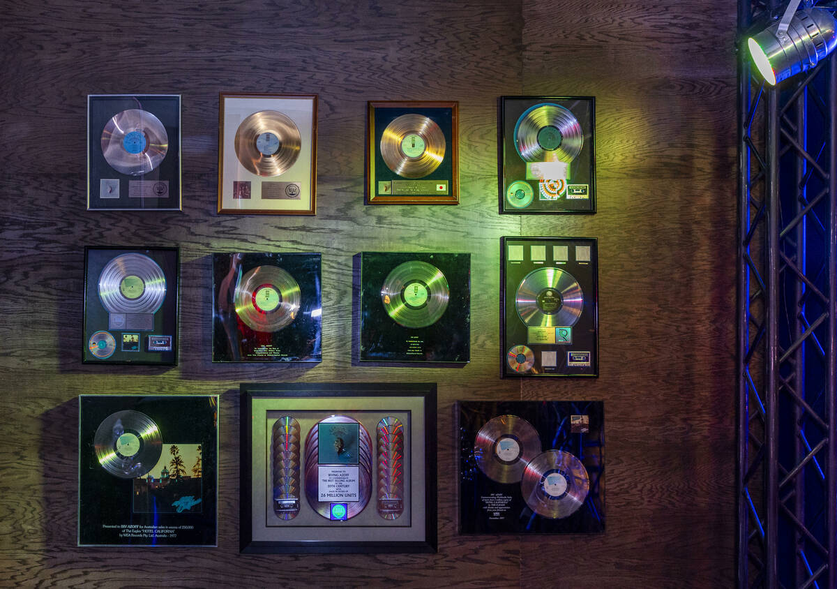 Gold records hang on the wall in a Troubadour replica within the Eagles exclusive fan experienc ...