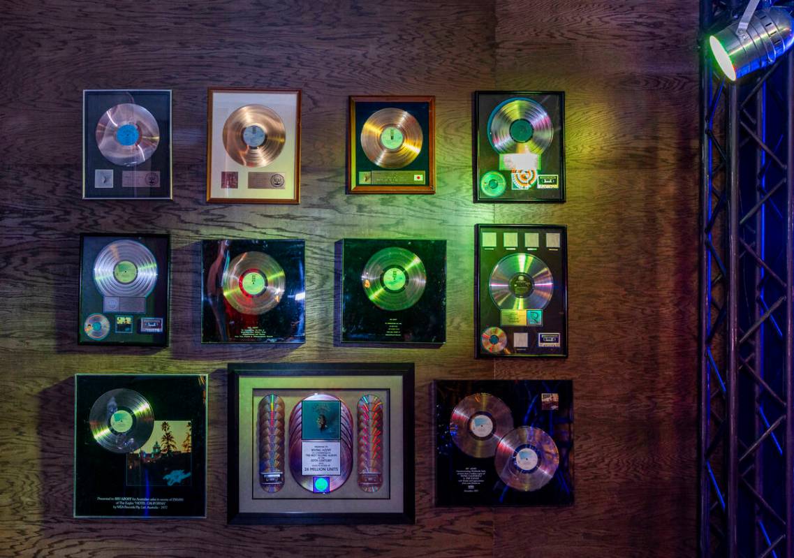 Gold records hang on the wall in a Troubadour replica within the Eagles exclusive fan experienc ...