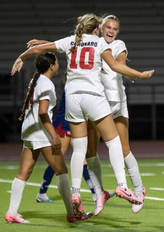 Coronado junior Ryan Neel (10) and junior Allison Kleiner (14) celebrate after a goal is scored ...