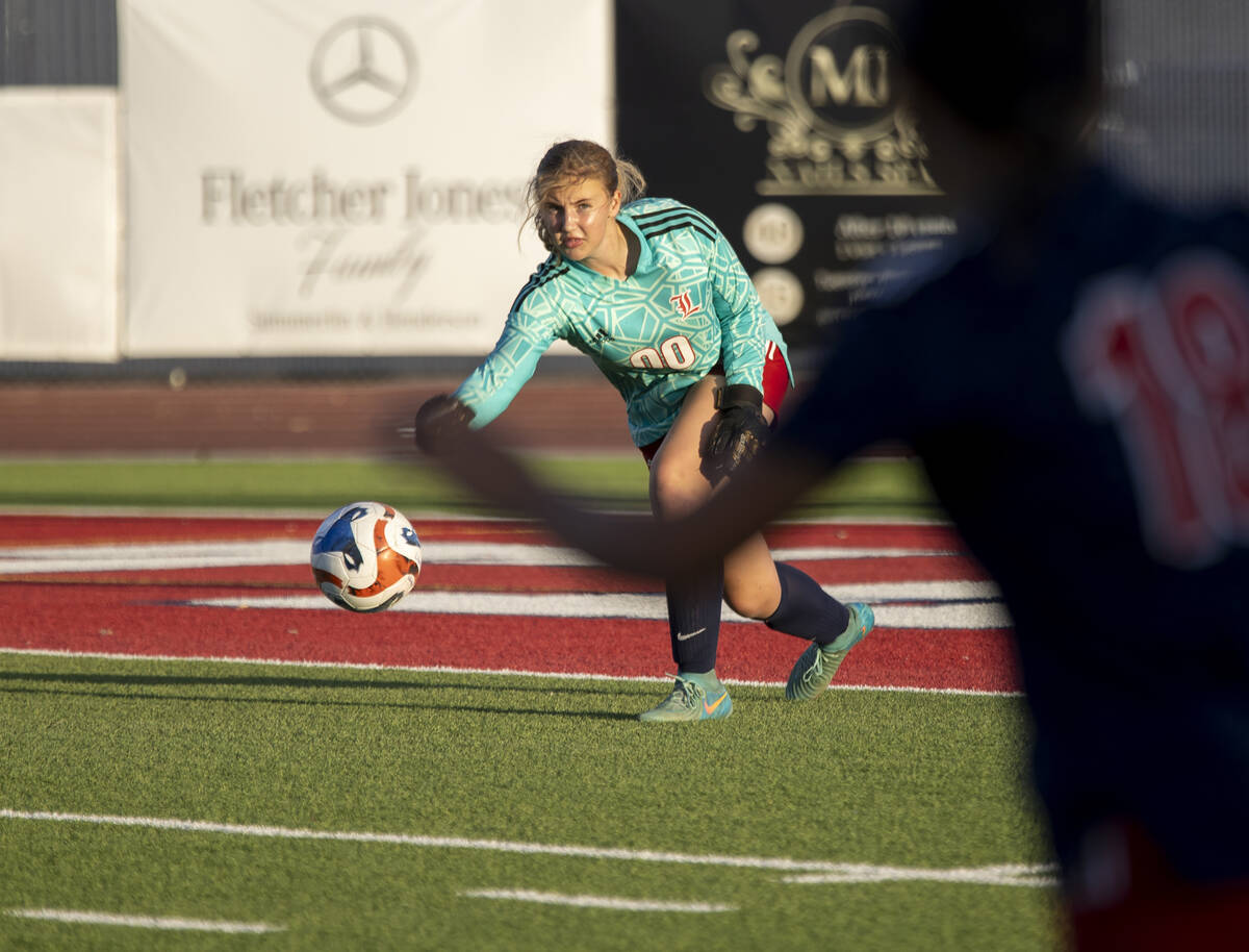 Liberty goalkeeper Brooke Kramer (00) passes the ball during the high school soccer game agains ...