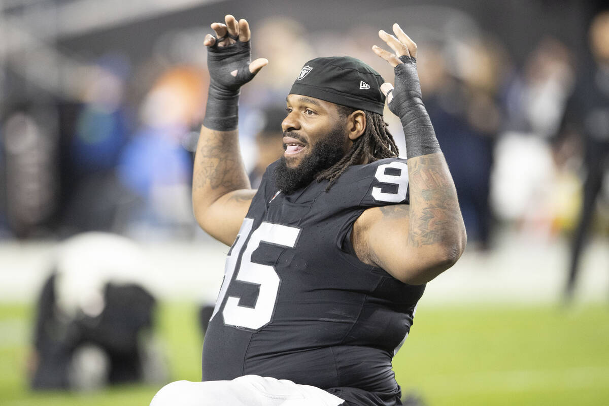 Raiders defensive tackle John Jenkins (95) stretches before an NFL game against the Los Angeles ...