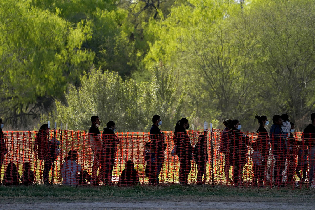 In this March 19, 2021, file photo, migrants are seen in custody at a U.S. Customs and Border P ...