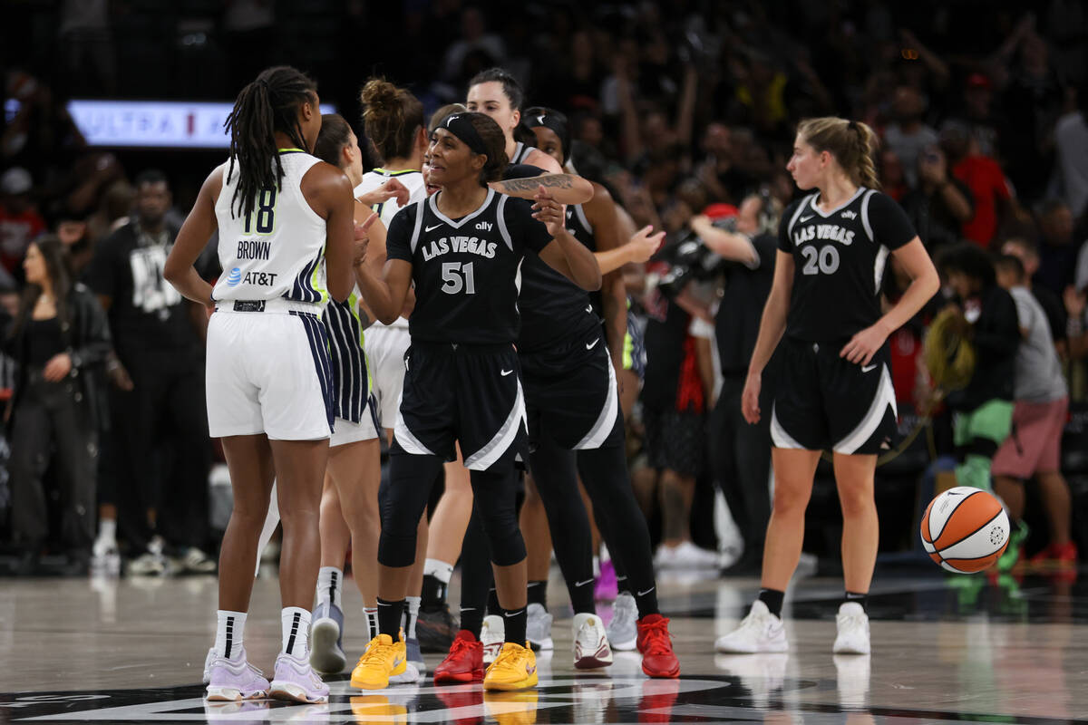 The Dallas Wings and the Las Vegas Aces greet each other after the Aces won their WNBA basketba ...