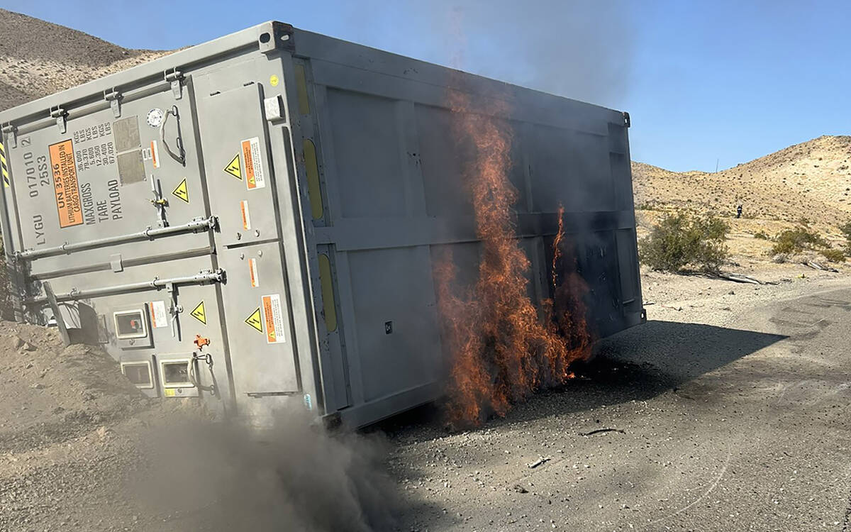 A 30-foot container, which was carrying lithium ion batteries, sits on the side of the road on ...