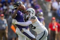 Raiders defensive end Maxx Crosby (98) sacks Baltimore Ravens quarterback Lamar Jackson (8) dur ...