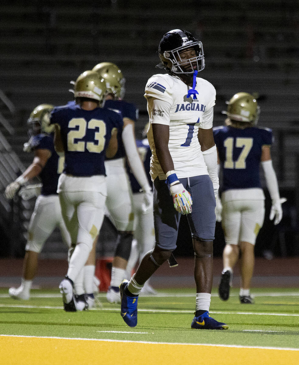 Desert Pines senior Ejuan Carter (1) slowly walks off the field after not converting on fourth ...