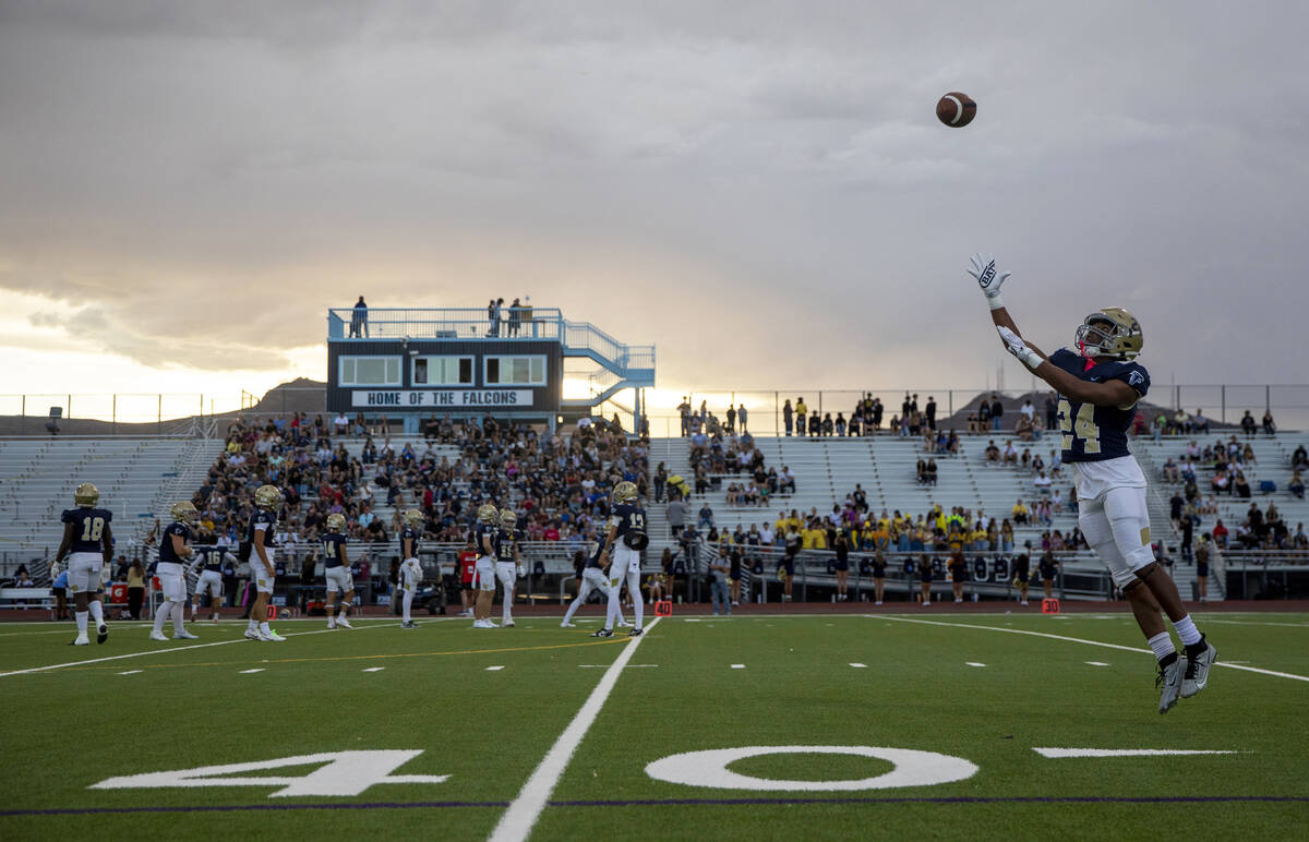 Foothill senior Lucas Allen (24) looks to catch a ball during a warm-up before the high school ...