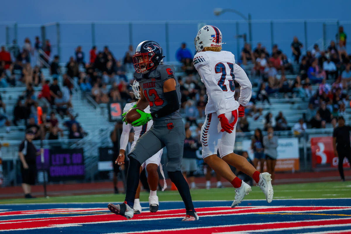 Coronado Wide Receiver Scott Holper (13) scores a touchdown during a football game between Libe ...