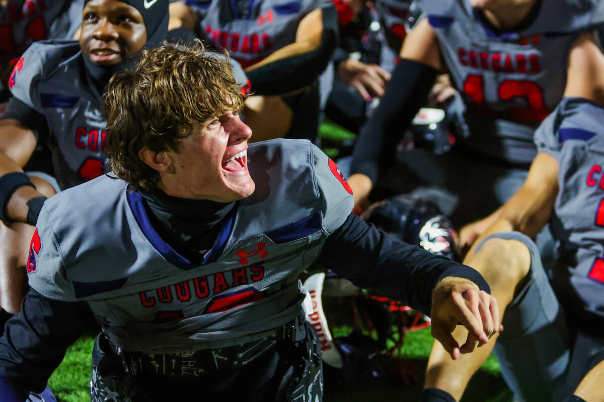 Coronado players celebrate winning the St. Rose Bowl after a football game between Liberty and ...