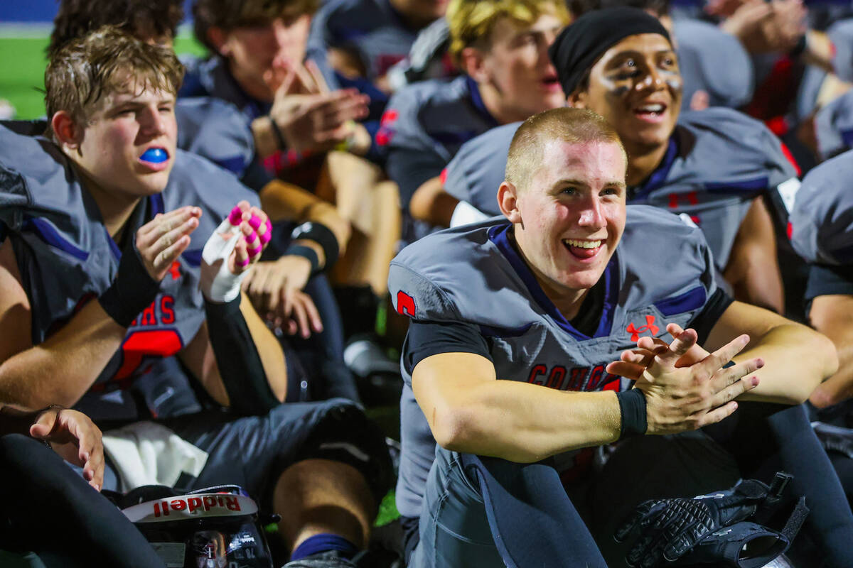 Coronado players celebrate winning the St. Rose Bowl after a football game between Liberty and ...