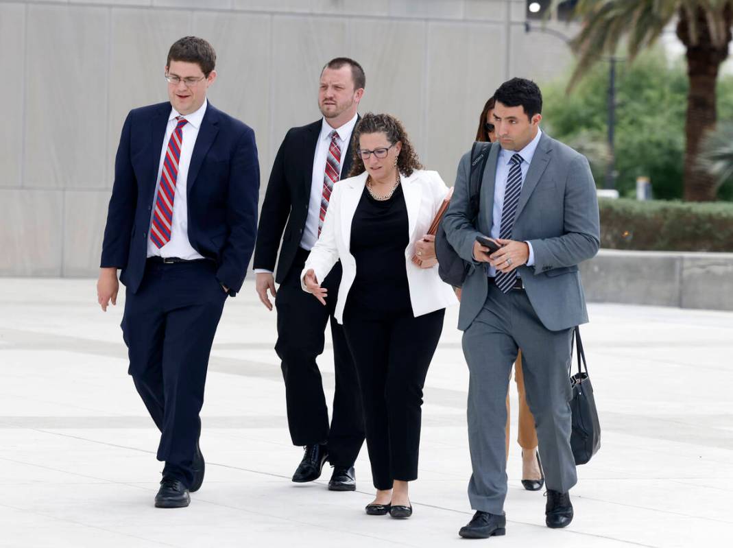 Attorneys, including Alexander Gottfried, left, and Dahoud Askar, right, of the Criminal Divisi ...