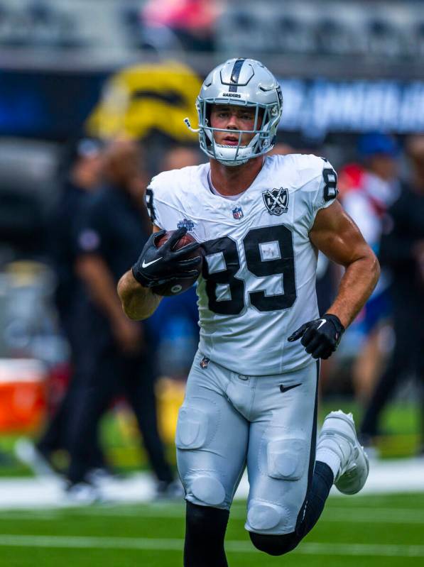 Raiders tight end Brock Bowers (89) runs with the ball as they warm up to face the Los Angeles ...